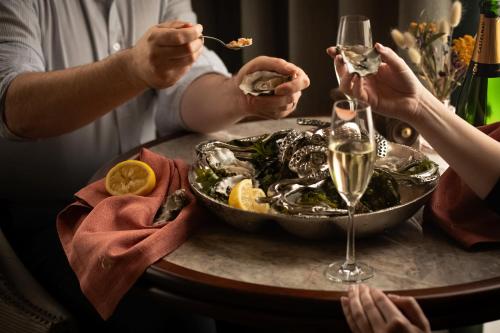 a group of people eating at a table with a bowl of food at Great Southern Killarney in Killarney