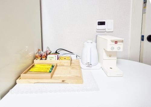 a kitchen with a counter with a coffee machine at Stay B in Sŭngch'ŏn-ni