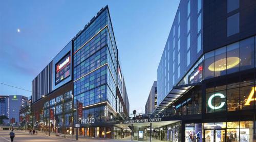 a group of tall buildings in a city at Modern 3-Bedroom Retreat Just Steps from Wembley Stadium in London
