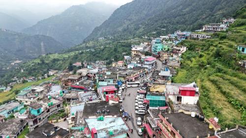 an aerial view of a village on a mountain at maa kalishila home stay in Ukhimath