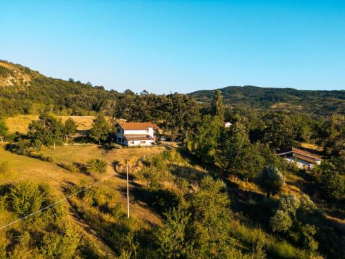 an aerial view of a house on a hill at Wild Orchard Farm in San Costantino Albanese