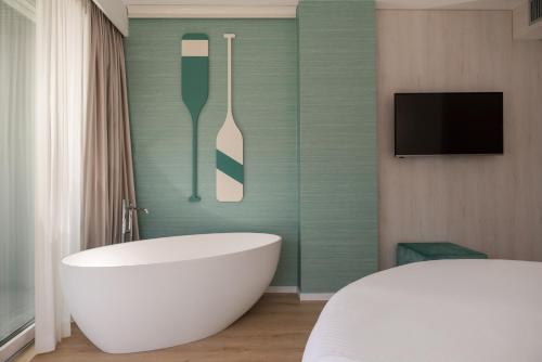 Кровать или кровати в номере Hotel Regina