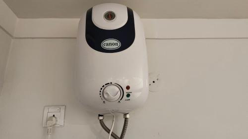 a hair dryer is on the wall of a room at Lyallpur Galleria Mall Apartment, 1 BHK, 1 Bedroom with Living Room, Basement Parking, 24x7 Security in Faisalabad