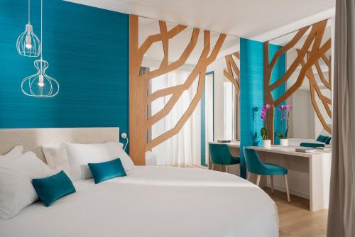 Кровать или кровати в номере Hotel Regina