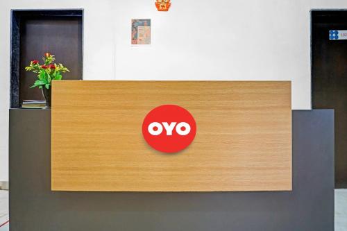 a sign that says oxy on top of a desk at Super Hotel O Pimpri Stays in Chinchiwad