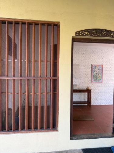 an open door to a room with a table at The Beach House Kalpitiya in Puttalam