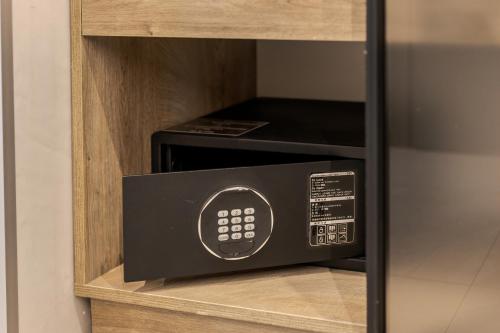 a microwave oven sitting inside of a cabinet at Rest&Ski Spa Resort in Bukovel