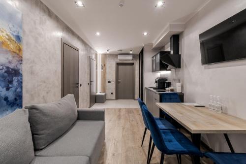 a living room with a couch and a table at Rest&Ski Spa Resort in Bukovel