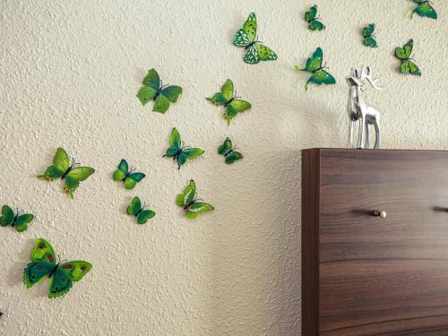 a group of butterflies on a wall at Hotel Mercure Wien City in Vienna