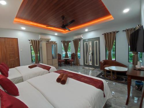 Ένα ή περισσότερα κρεβάτια σε δωμάτιο στο Ku's Roomstay 2 - Free Netflix & Wifi