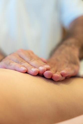 a person with their hands on the back of a couch at Försterhaus & Haus Andrea in Mayrhofen