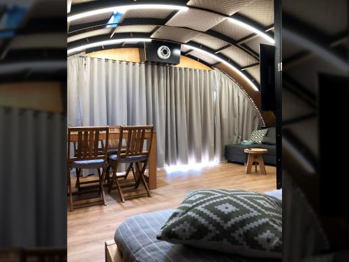 a room with a table and a dining room at Osada Marchowo in Kielno