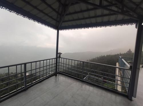 a view from the top of a building with a balcony at Voga View Hotel and Restro in Mussoorie