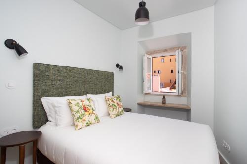 Ένα ή περισσότερα κρεβάτια σε δωμάτιο στο Hermitage Castelo - Casa Saint Jorge