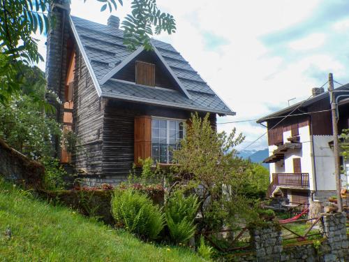 a house with a gambrel roof on a hill at La Stellina in Garda