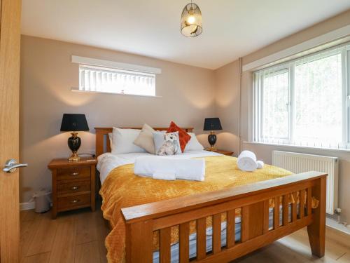 En eller flere senge i et værelse på Wigley Farm House Cottage