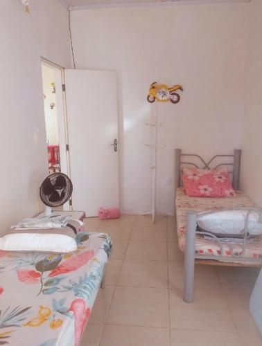 Giường trong phòng chung tại Sol mar Lua