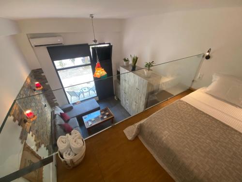 a small room with a bed and a couch at Sophia Loft Luxury Stay with Parking in Athens