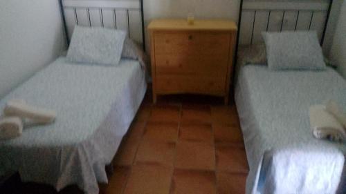 En eller flere senge i et værelse på Casa Rural Cuesta Málaga