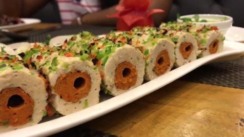 a plate of sushi on top of a table at Hotel Time Square -Gandhiji Road, Old Bus Stand, Opp clock Tower ,Thanjavur in Thanjāvūr