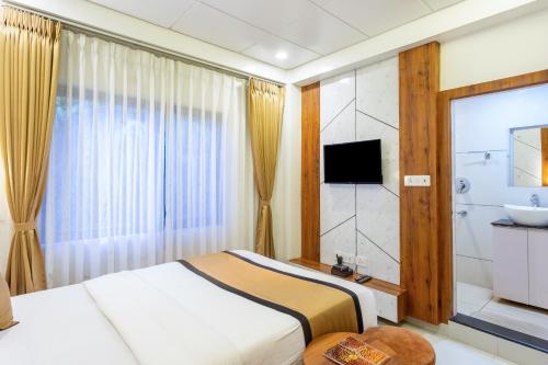 TV a/nebo společenská místnost v ubytování Accom Hotel