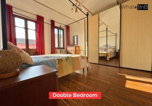 Una cama o camas en una habitación de Nel Cuore D'Isola D'Asti