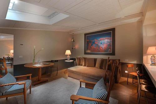 a living room with a couch and a table at Maison Borella in Milan