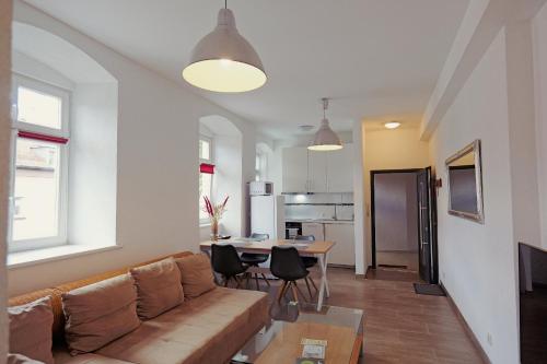 a living room with a couch and a table at Spacious family apartment in Bamberg in Bamberg