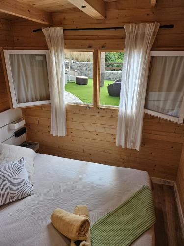 a bedroom with a large bed with a window at Gándara lodge in Tijoco de Abajo