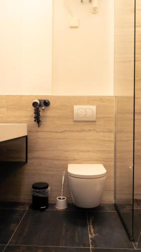 a bathroom with a toilet and a sink at Elias Residence Vienna in Vienna