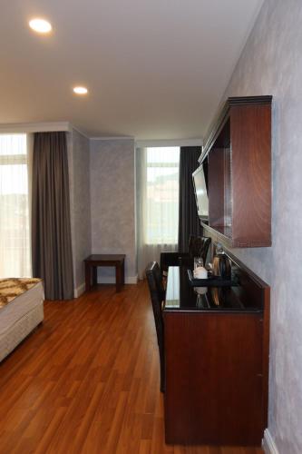Una cama o camas en una habitación de Era Palace Batumi