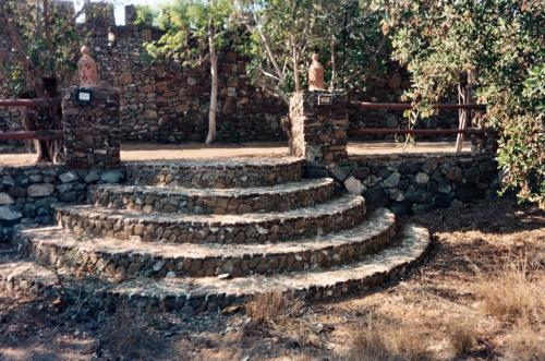 a set of stone stairs in front of a stone wall at Bidyah camp in Ḩaqīl