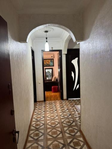 a hallway with a tile floor in a house at John Apartment Old Batumi in Batumi