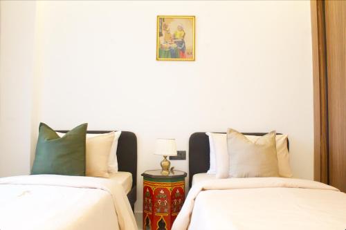 En eller flere senge i et værelse på Azra Mila Appart luxe famille uniquement