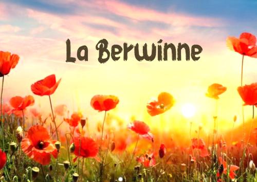 a field of red poppies with the words la beaumime at Le Grand Jardin in Dalhem