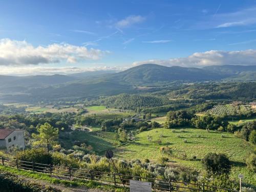 a view of a valley with mountains in the distance at Casa Betta - A 700 Year Old Tuscan Gem in Chiusdino