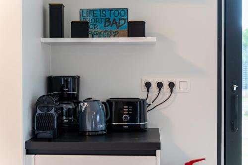 a kitchen with a counter top with appliances on it at Villa Weidezicht in Heusden - Zolder
