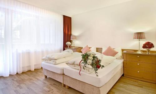 Postel nebo postele na pokoji v ubytování Appartement Alpen Lodge