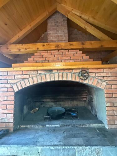 a brick oven with a pan inside of it at Ice Queen Vlasic in Šišava