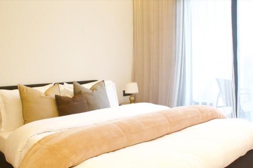 En eller flere senge i et værelse på Azra Mila Appart luxe famille uniquement