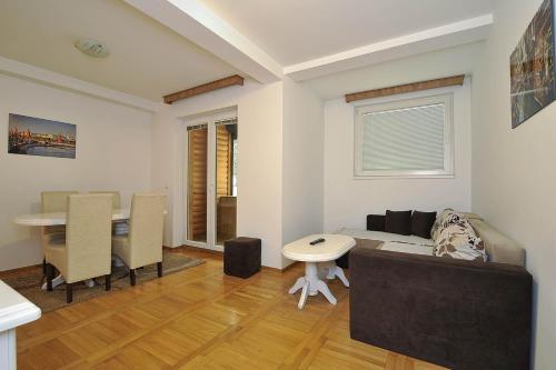 a living room with a couch and a table at Vila Mina in Zlatibor