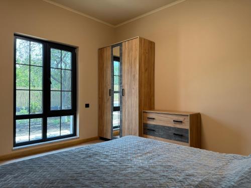 Postel nebo postele na pokoji v ubytování Bambooresthouse