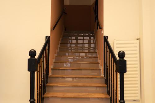 a staircase in a building with wooden steps at Elias Residence Vienna in Vienna