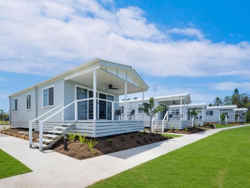 a modular home with a porch and grass at Mercure Townsville in Townsville
