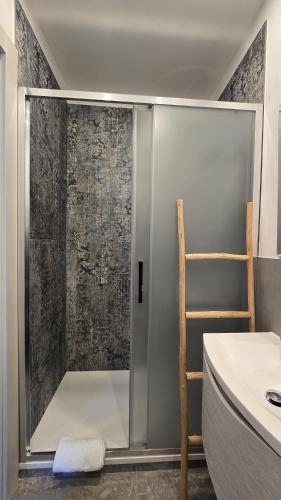 a shower with a glass door in a bathroom at LA PIAZZETTA - Homy 5 Terre in Volastra