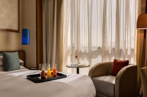 Cama ou camas em um quarto em Rosh Rayhaan by Rotana