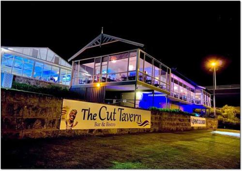 a building with a sign in front of it at night at Wannanup Retreat in Wannanup