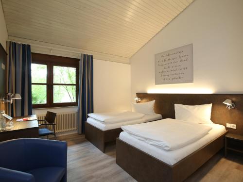 Postel nebo postele na pokoji v ubytování Tagungshaus Wernau