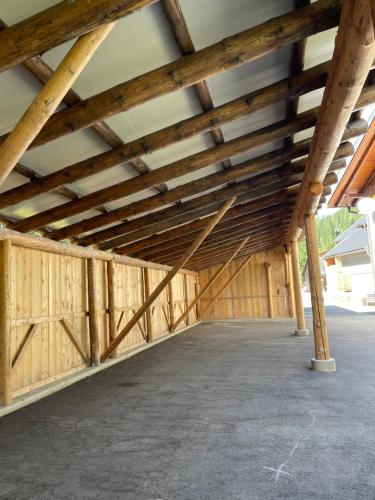 a large wooden garage with a vaulted ceiling at Ferienwohnungen zum Klammlhof in Ebene Reichenau