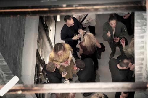 a group of people standing around in a room at Hotel Ottilia in Copenhagen